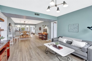 Beautifully updated & artist-decorated 2-bed, 2-bath condo with on Pine Island Ridge Country Club in Florida - for sale on GolfHomes.com, golf home, golf lot