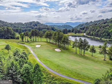 This lot offers great mountain views and Sky Valley city on Sky Valley Resort and Country Club in Georgia - for sale on GolfHomes.com, golf home, golf lot
