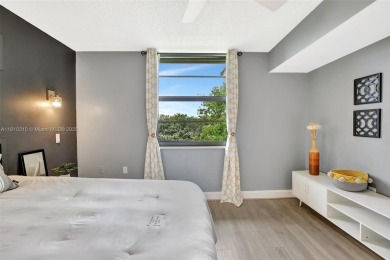 Beautifully updated & artist-decorated 2-bed, 2-bath condo with on Pine Island Ridge Country Club in Florida - for sale on GolfHomes.com, golf home, golf lot