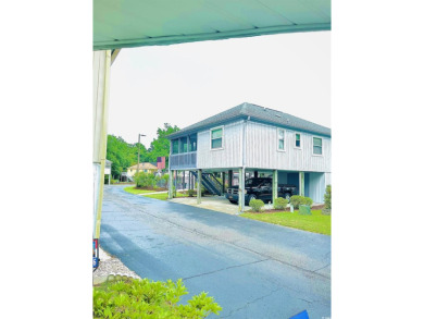 Welcome to your coastal retreat in the sought-after Willow Creek on Possum Trot Golf Course in South Carolina - for sale on GolfHomes.com, golf home, golf lot