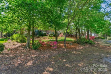 Stunning full-brick estate overlooking Ballantyne Country Club's on Ballantyne Resort and Country Club in North Carolina - for sale on GolfHomes.com, golf home, golf lot