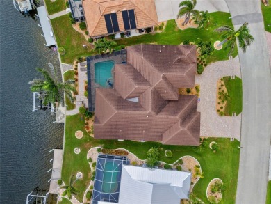 PUNTA GORDA ISLES!! STUNNING 3 BEDROOM PLUS DEN, 3 BATH, 3 CAR on Saint Andrews South Golf Club in Florida - for sale on GolfHomes.com, golf home, golf lot