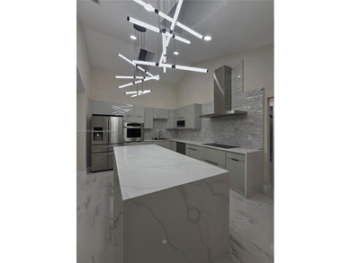 Modern paradise in PGA National, Cul-de-sac, 4/2 pool house on PGA National Golf Club in Florida - for sale on GolfHomes.com, golf home, golf lot