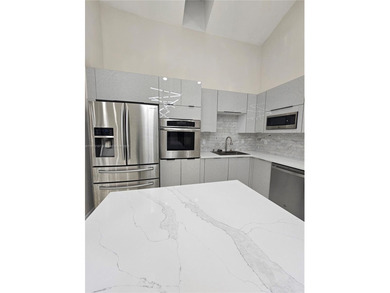 Modern paradise in PGA National, Cul-de-sac, 4/2 pool house on PGA National Golf Club in Florida - for sale on GolfHomes.com, golf home, golf lot