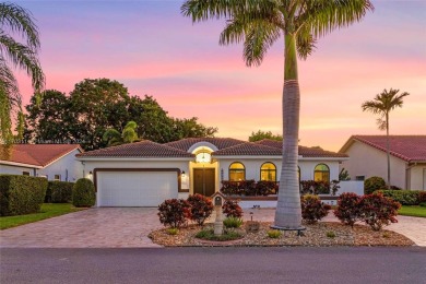 This gorgeous meticulously maintained split-bedroom home is on Woodmont Country Club in Florida - for sale on GolfHomes.com, golf home, golf lot