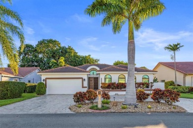 This gorgeous meticulously maintained split-bedroom home is on Woodmont Country Club in Florida - for sale on GolfHomes.com, golf home, golf lot