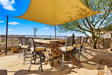 This stunning 5-bedroom, 4-bathroom custom home, built in 2011 on Laughlin Ranch Golf Club in Arizona - for sale on GolfHomes.com, golf home, golf lot