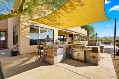 This stunning 5-bedroom, 4-bathroom custom home, built in 2011 on Laughlin Ranch Golf Club in Arizona - for sale on GolfHomes.com, golf home, golf lot