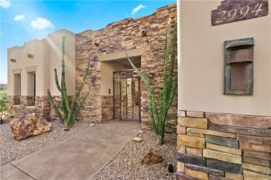 This stunning 5-bedroom, 4-bathroom custom home, built in 2011 on Laughlin Ranch Golf Club in Arizona - for sale on GolfHomes.com, golf home, golf lot