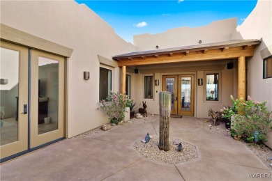 This stunning 5-bedroom, 4-bathroom custom home, built in 2011 on Laughlin Ranch Golf Club in Arizona - for sale on GolfHomes.com, golf home, golf lot