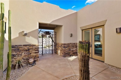 This stunning 5-bedroom, 4-bathroom custom home, built in 2011 on Laughlin Ranch Golf Club in Arizona - for sale on GolfHomes.com, golf home, golf lot