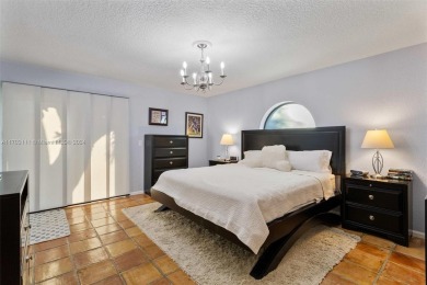 This gorgeous meticulously maintained split-bedroom home is on Woodmont Country Club in Florida - for sale on GolfHomes.com, golf home, golf lot