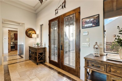 This stunning 5-bedroom, 4-bathroom custom home, built in 2011 on Laughlin Ranch Golf Club in Arizona - for sale on GolfHomes.com, golf home, golf lot