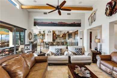 This stunning 5-bedroom, 4-bathroom custom home, built in 2011 on Laughlin Ranch Golf Club in Arizona - for sale on GolfHomes.com, golf home, golf lot