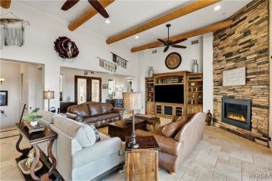 This stunning 5-bedroom, 4-bathroom custom home, built in 2011 on Laughlin Ranch Golf Club in Arizona - for sale on GolfHomes.com, golf home, golf lot