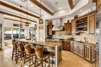 This stunning 5-bedroom, 4-bathroom custom home, built in 2011 on Laughlin Ranch Golf Club in Arizona - for sale on GolfHomes.com, golf home, golf lot