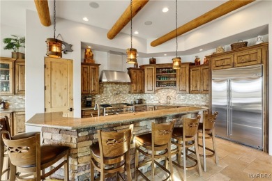 This stunning 5-bedroom, 4-bathroom custom home, built in 2011 on Laughlin Ranch Golf Club in Arizona - for sale on GolfHomes.com, golf home, golf lot