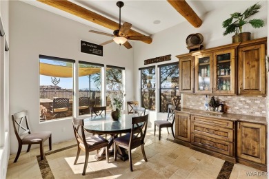 This stunning 5-bedroom, 4-bathroom custom home, built in 2011 on Laughlin Ranch Golf Club in Arizona - for sale on GolfHomes.com, golf home, golf lot