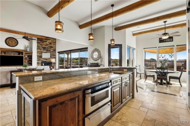 This stunning 5-bedroom, 4-bathroom custom home, built in 2011 on Laughlin Ranch Golf Club in Arizona - for sale on GolfHomes.com, golf home, golf lot