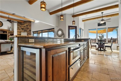 This stunning 5-bedroom, 4-bathroom custom home, built in 2011 on Laughlin Ranch Golf Club in Arizona - for sale on GolfHomes.com, golf home, golf lot