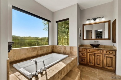 This stunning 5-bedroom, 4-bathroom custom home, built in 2011 on Laughlin Ranch Golf Club in Arizona - for sale on GolfHomes.com, golf home, golf lot