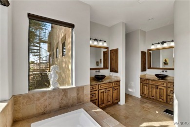 This stunning 5-bedroom, 4-bathroom custom home, built in 2011 on Laughlin Ranch Golf Club in Arizona - for sale on GolfHomes.com, golf home, golf lot