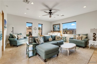 This stunning 5-bedroom, 4-bathroom custom home, built in 2011 on Laughlin Ranch Golf Club in Arizona - for sale on GolfHomes.com, golf home, golf lot