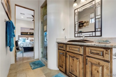 This stunning 5-bedroom, 4-bathroom custom home, built in 2011 on Laughlin Ranch Golf Club in Arizona - for sale on GolfHomes.com, golf home, golf lot