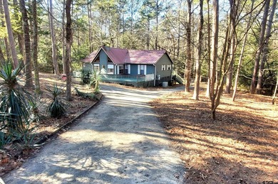 Beautiful chalet style home with Personality plus nestled on two on Holly Lake Ranch Golf Club in Texas - for sale on GolfHomes.com, golf home, golf lot