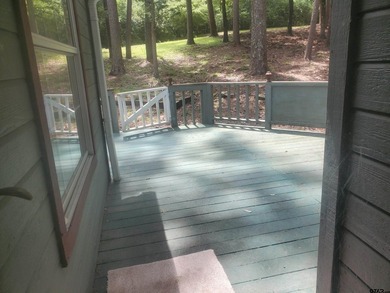 Beautiful chalet style home with Personality plus nestled on two on Holly Lake Ranch Golf Club in Texas - for sale on GolfHomes.com, golf home, golf lot