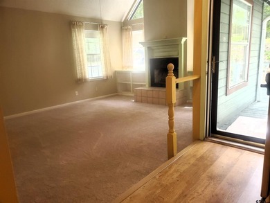 Beautiful chalet style home with Personality plus nestled on two on Holly Lake Ranch Golf Club in Texas - for sale on GolfHomes.com, golf home, golf lot