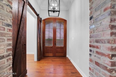 Discover luxury living at its finest in this custom home located on LeTriomphe Golf and Country Club in Louisiana - for sale on GolfHomes.com, golf home, golf lot