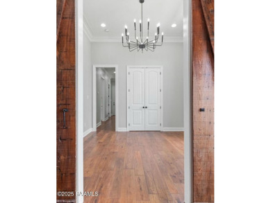 Discover luxury living at its finest in this custom home located on LeTriomphe Golf and Country Club in Louisiana - for sale on GolfHomes.com, golf home, golf lot