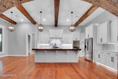 Discover luxury living at its finest in this custom home located on LeTriomphe Golf and Country Club in Louisiana - for sale on GolfHomes.com, golf home, golf lot