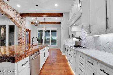Discover luxury living at its finest in this custom home located on LeTriomphe Golf and Country Club in Louisiana - for sale on GolfHomes.com, golf home, golf lot