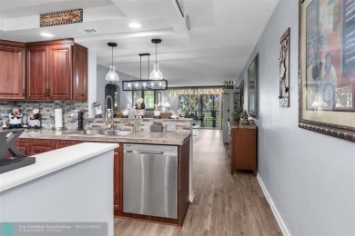UPDATED & MOVE-IN READY! Turnkey in Portofino at Wynmoor with on Wynmoor Golf Course in Florida - for sale on GolfHomes.com, golf home, golf lot