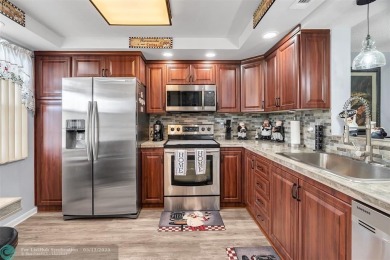 UPDATED & MOVE-IN READY! Turnkey in Portofino at Wynmoor with on Wynmoor Golf Course in Florida - for sale on GolfHomes.com, golf home, golf lot