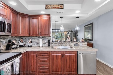 UPDATED & MOVE-IN READY! Turnkey in Portofino at Wynmoor with on Wynmoor Golf Course in Florida - for sale on GolfHomes.com, golf home, golf lot