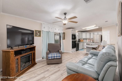 Welcome to this charming 2-bedroom, 2-bathroom manufactured home on Barefoot Bay Golf Course in Florida - for sale on GolfHomes.com, golf home, golf lot