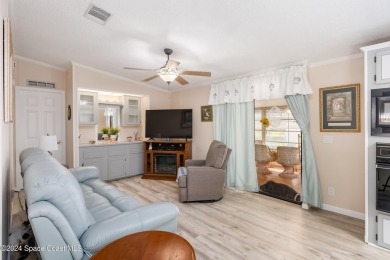 Welcome to this charming 2-bedroom, 2-bathroom manufactured home on Barefoot Bay Golf Course in Florida - for sale on GolfHomes.com, golf home, golf lot