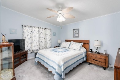 Welcome to this charming 2-bedroom, 2-bathroom manufactured home on Barefoot Bay Golf Course in Florida - for sale on GolfHomes.com, golf home, golf lot