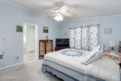 Welcome to this charming 2-bedroom, 2-bathroom manufactured home on Barefoot Bay Golf Course in Florida - for sale on GolfHomes.com, golf home, golf lot