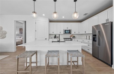 This stunning Mystique Home which is currently under on Valencia Golf and Country Club in Florida - for sale on GolfHomes.com, golf home, golf lot