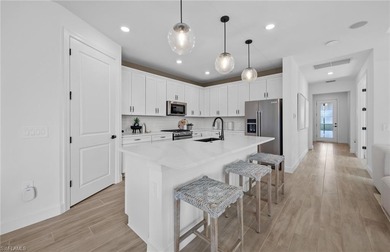 This stunning Mystique Home which is currently under on Valencia Golf and Country Club in Florida - for sale on GolfHomes.com, golf home, golf lot