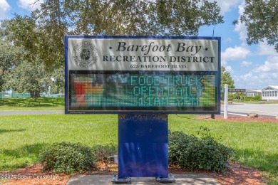 Welcome to this charming 2-bedroom, 2-bathroom manufactured home on Barefoot Bay Golf Course in Florida - for sale on GolfHomes.com, golf home, golf lot