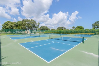 Welcome to this charming 2-bedroom, 2-bathroom manufactured home on Barefoot Bay Golf Course in Florida - for sale on GolfHomes.com, golf home, golf lot