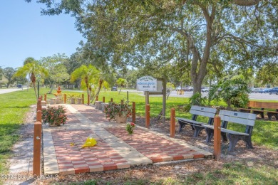 Welcome to this charming 2-bedroom, 2-bathroom manufactured home on Barefoot Bay Golf Course in Florida - for sale on GolfHomes.com, golf home, golf lot