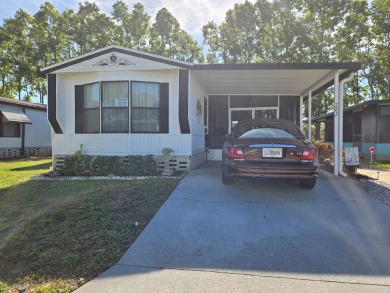 This immaculate, well maintained 2/2 manufactured home is a must on Lake Henry Golf Club in Florida - for sale on GolfHomes.com, golf home, golf lot