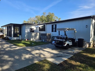 This immaculate, well maintained 2/2 manufactured home is a must on Lake Henry Golf Club in Florida - for sale on GolfHomes.com, golf home, golf lot