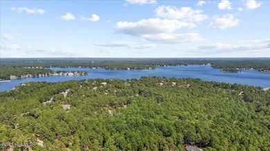 Nestled on the golf course in the gated community of Seven Lakes on Beacon Ridge Golf and Country Club in North Carolina - for sale on GolfHomes.com, golf home, golf lot